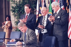 Bill Clinton signing NAFTA, the first disaster He's no Huckleberry